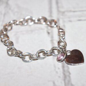 Beautiful silver charm bracelet with heart and pink charm 7"